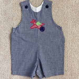 Black gingham alligator flyinging airplane Jon Jon